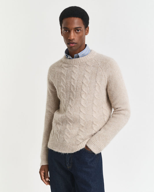 Pull ras du cou en maille torsadée